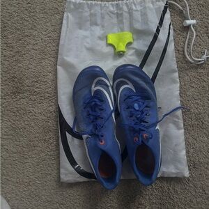 Blue Nike Ja Fly track spikes